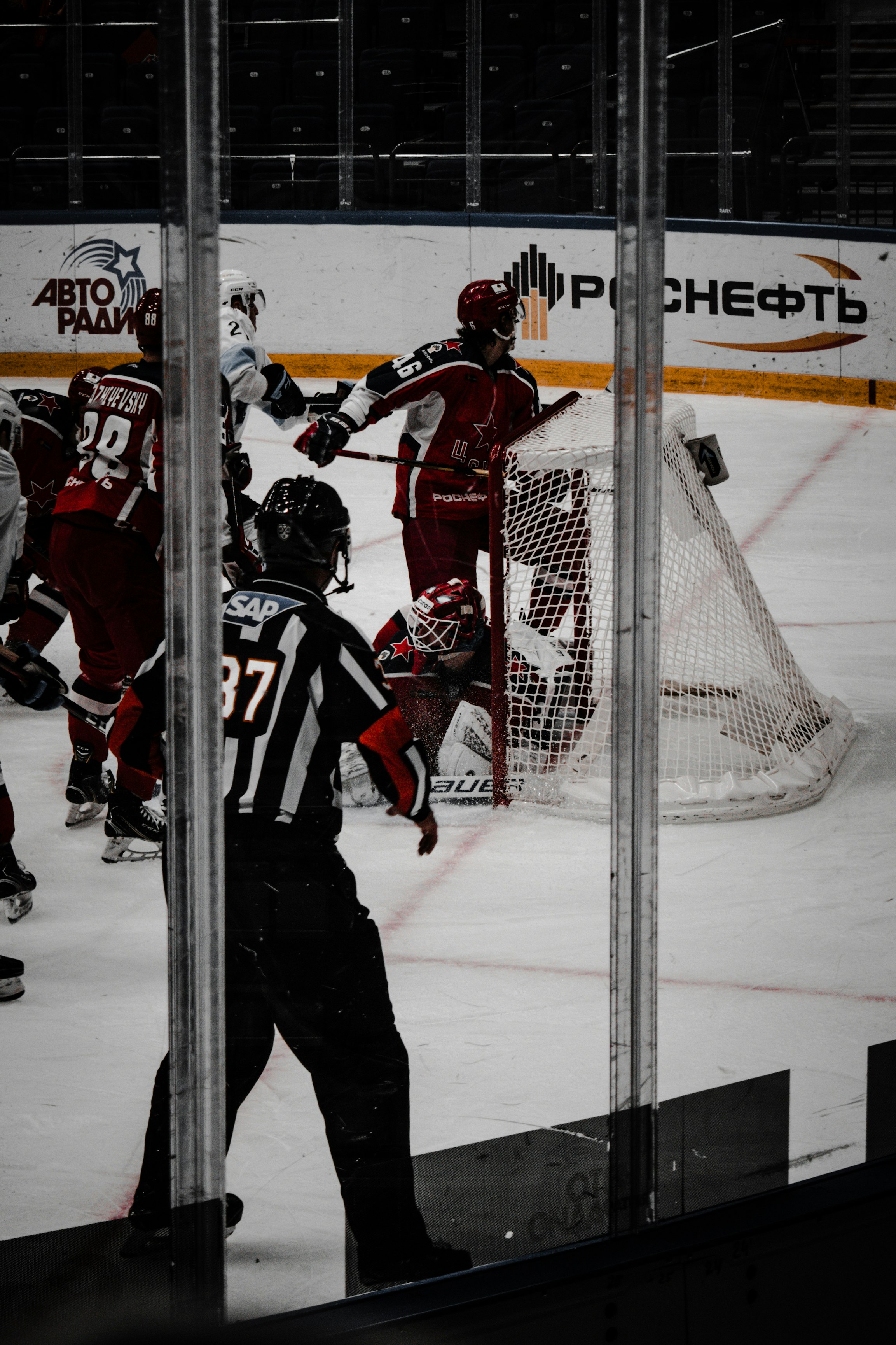 2 men in red and white ice hockey jersey